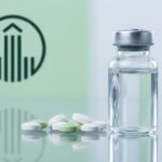 Medicine vial with a metal cap beside scattered white and green tablets on a reflective surface, with a green medical symbol in the background.