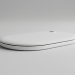 White circular wireless charging pad resting on a light gray surface, minimal and modern design