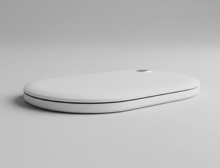 White circular wireless charging pad resting on a light gray surface, minimal and modern design